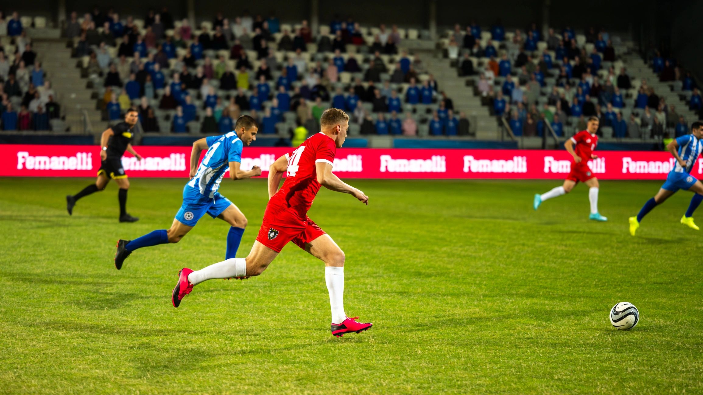 College soccer players competing on the field